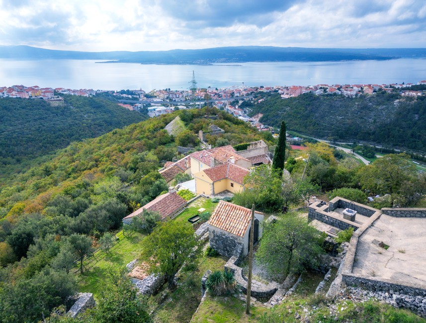 Aerial view of Kotor hilltop village with scenic greenery and a view of the Adriatic Sea near Crikvenica.
