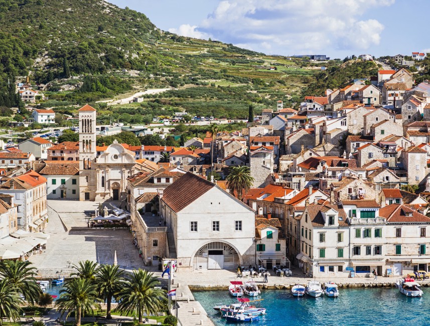 Scenic panoramic view of Hvar town on Hvar Island, Croatia, featuring historic architecture, the Adriatic Sea, and a vibrant harbor – Aminess destination travel.
