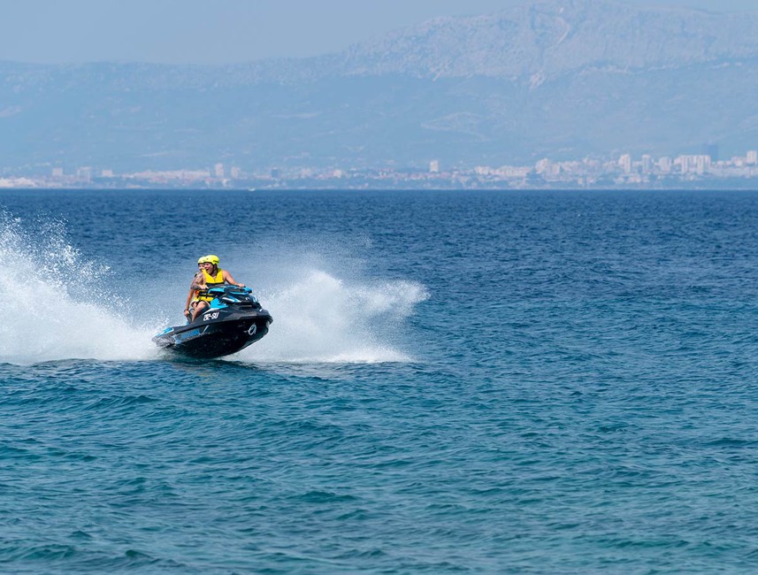 Scenic view of Brač Island, Croatia, showcasing sunny weather, clear blue skies, and the shimmering Adriatic Sea – Aminess destination travel.