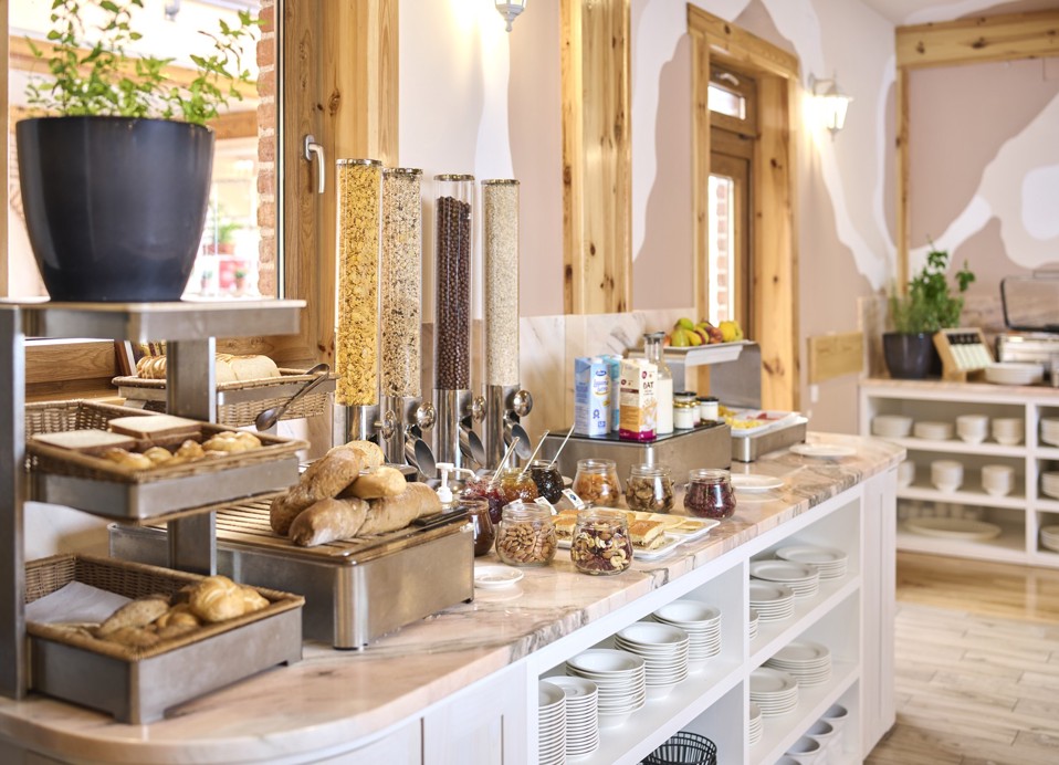 Breakfast buffet with bread and cereals at the Aminess Kadoor Hotel restaurant.