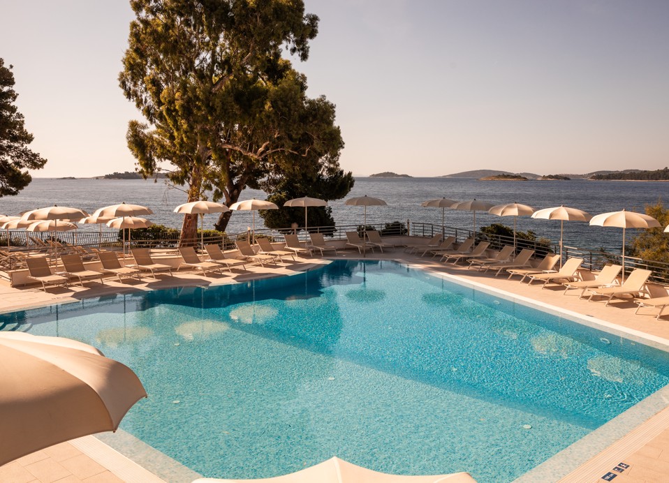 Pool night view featuring a sea view near Aminess Maradiso Casa Bellevue.