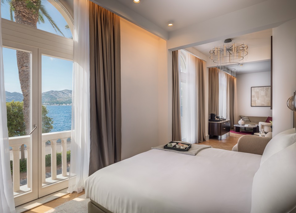 Luxury suite with balcony and sea view at Younique Korcula Heritage Hotel.