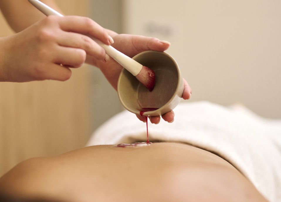 Relaxing hot stone massage at Aminess Style Camping Atea Resort spa, enhancing wellness and comfort.