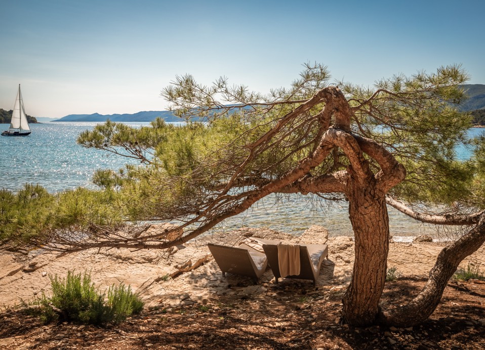 Beach and sea in front of Aminess Younique Senses Resort Hvar