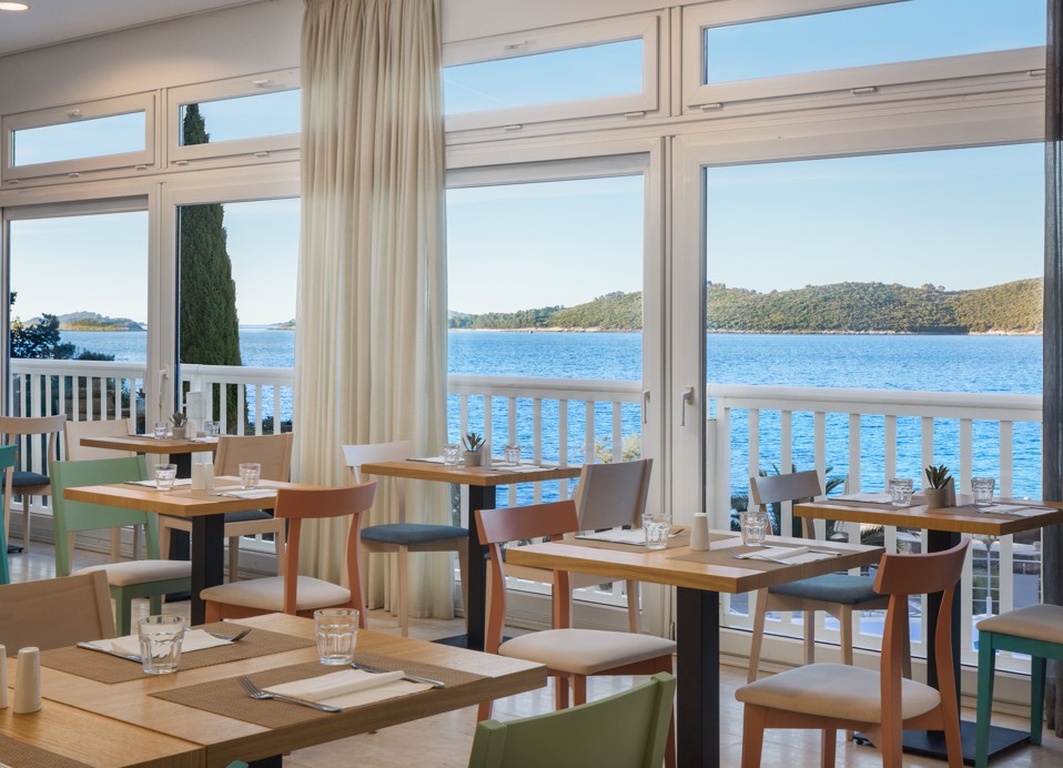 Restaurant at Orsan Maradiso Hotel by Aminess with a sea view.