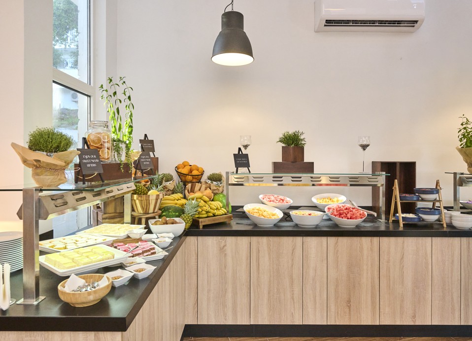 A richly stocked buffet at Restaurant Rondela, with fresh ingredients and creative presentations under stylish lighting at Aminess Maradiso Casa Bellevue.