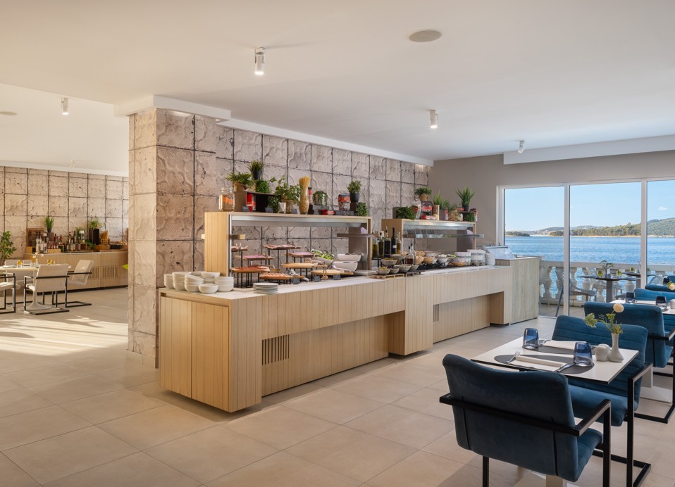 Buffet restaurant at Younique Bellevue Hotel by Aminess with a sea view.