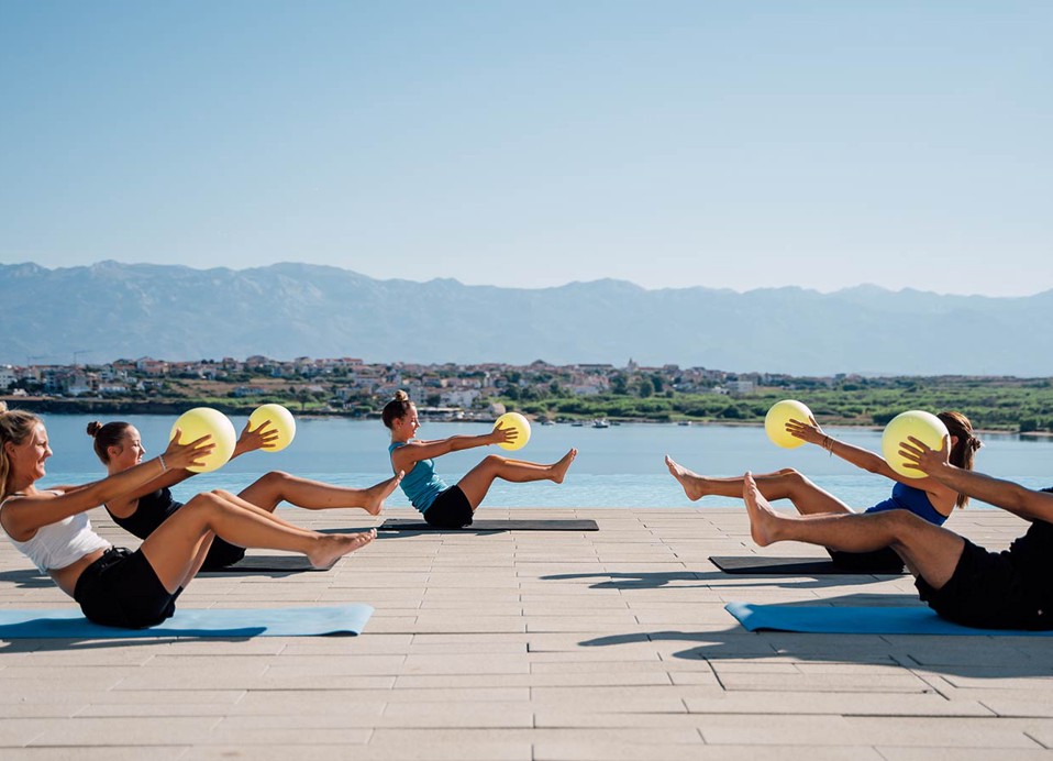 Morning exercise by the relax pool at Aminess Style Camping Avalona resort.