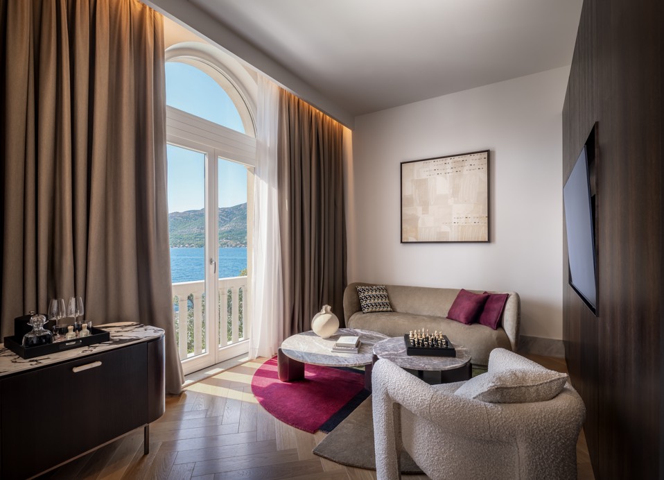 Luxury suite with balcony and sea view at Younique Korcula Heritage Hotel.