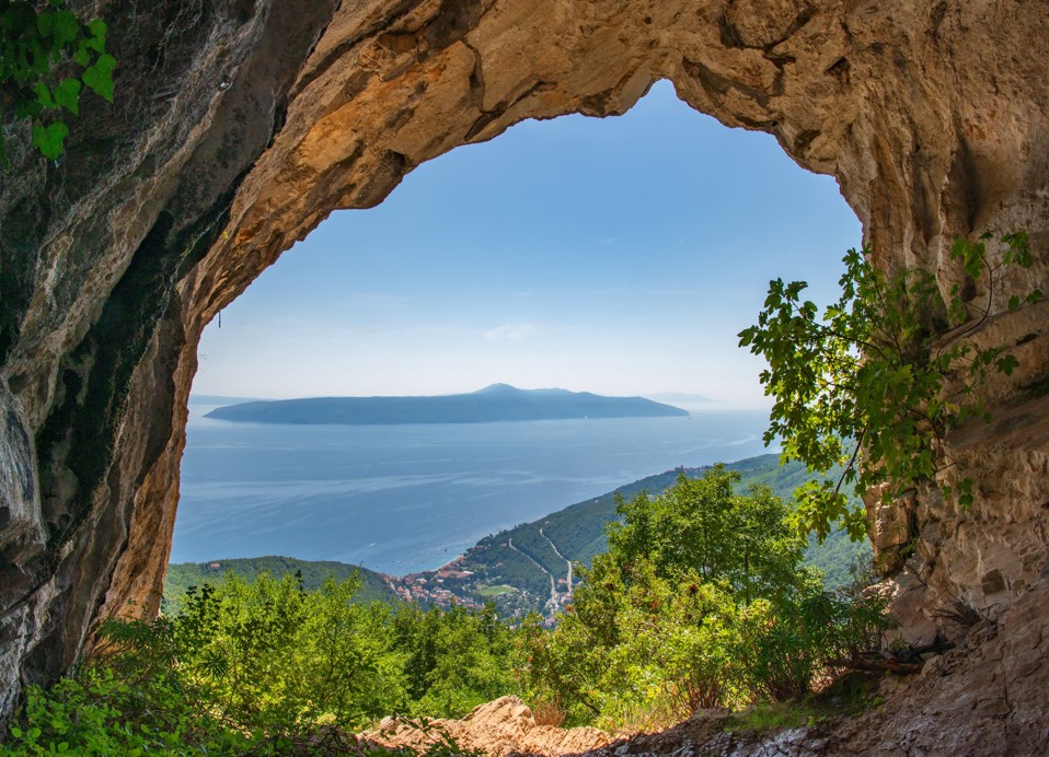 View through a rock arch on Učka towards the Kvarner Bay