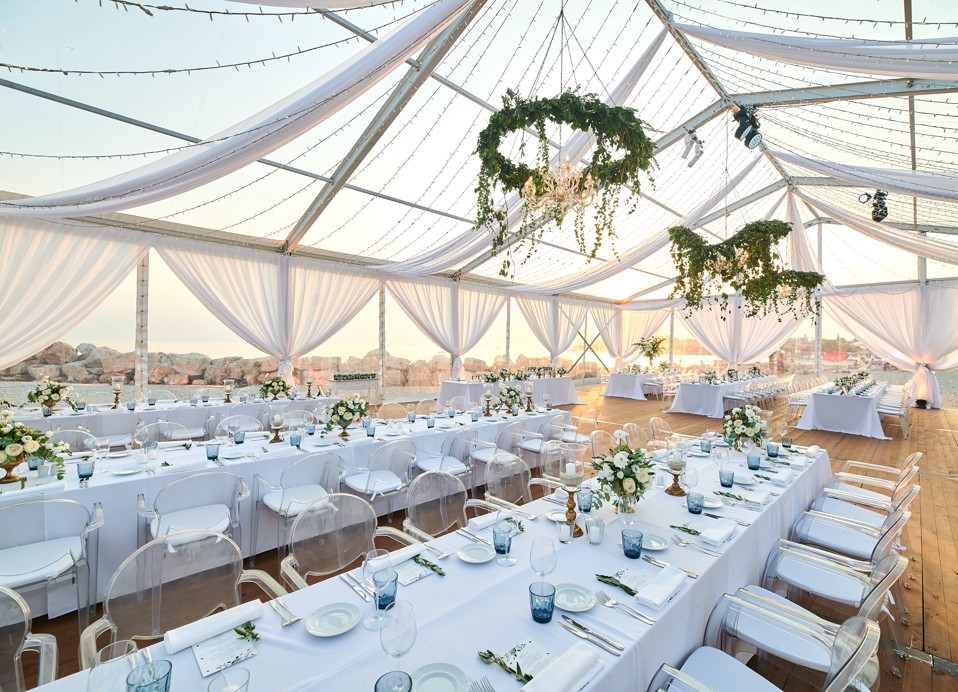 A wedding tent decorated at Punto Mare, by the sea.