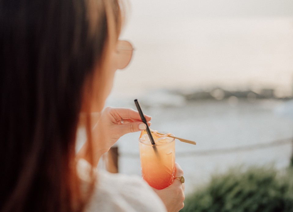 Women drinking a cocktail at Oleandar Bar in Aminess Planet Camping Sirena, Novigrad, Croatia