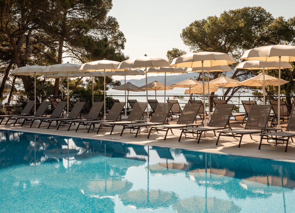Outdoor pool at Aminess Younique Senses Resort on Hvar Island with sunbeds and sea view