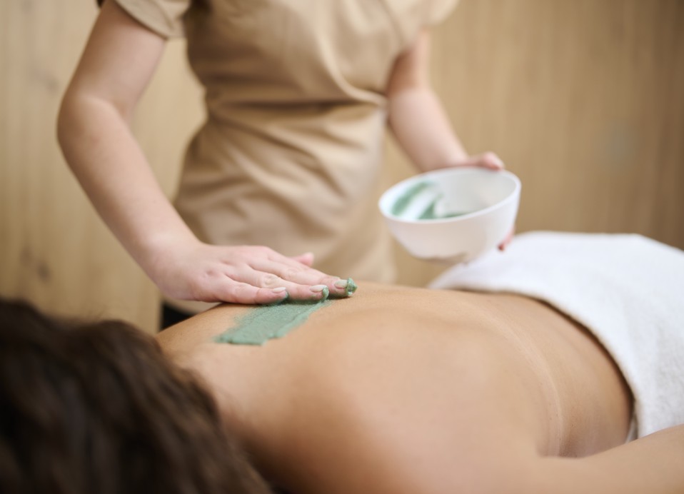 Rejuvenating back massage therapy at the Aminess Style Camping Atea Resort spa for stress relief.