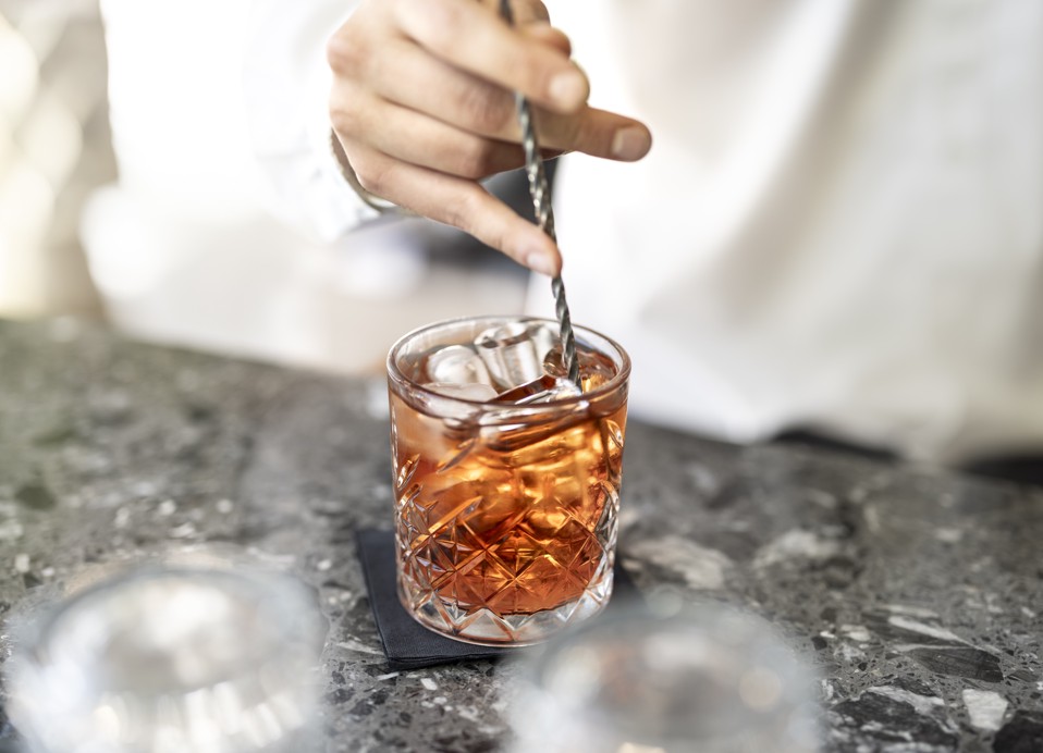Refreshing cocktail being prepared at the lobby bar of Aminess Younique Narrivi Hotel.