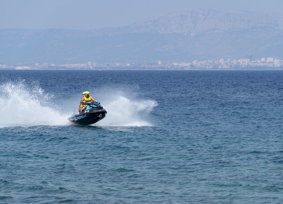 et Ski on the clear blue waters off the coast of Aminess Younique Senses Resort Hvar, offering an exciting water sport experience in a stunning seaside setting