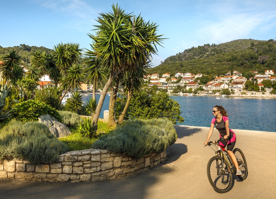 Guests enjoying a cycling tour around the beautiful surroundings near Port9 Planet Camping by Aminess.