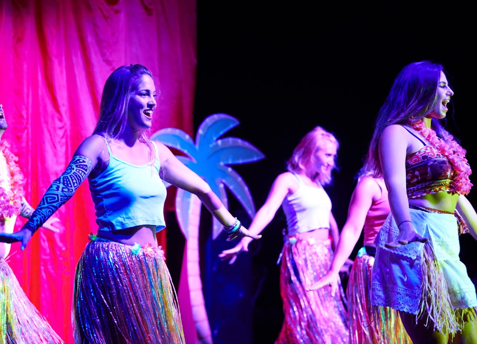 A vibrant themed dance show performed by the animation team at Magal Maradiso Hotel by Aminess.