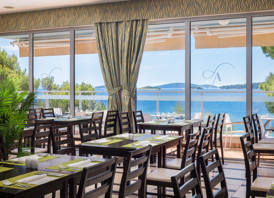 Restaurant interior at Aminess Vival Grand Azur Hotel with a sea view.