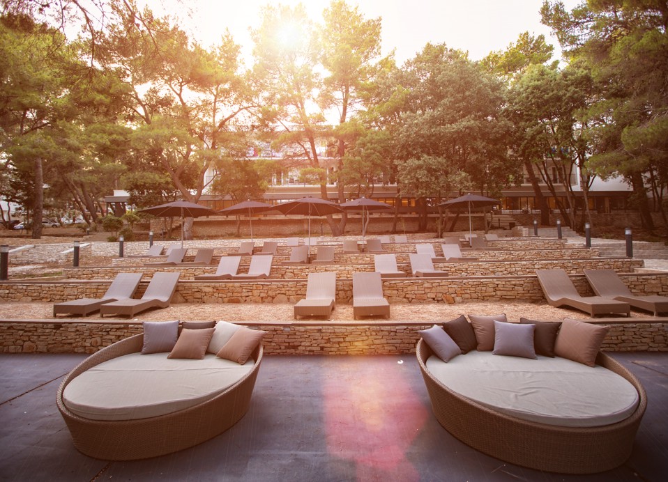 Sun loungers by the beach at Aminess Younique Senses Resort Hvar