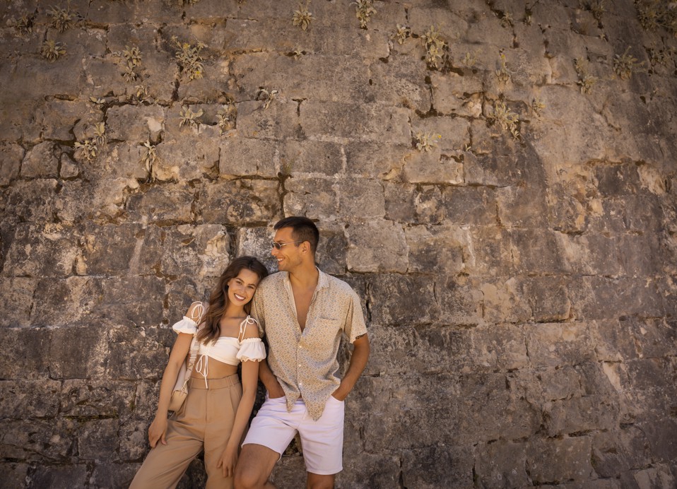 Couple enjoying hinking and walking trails of Forteca fort in the surrouding of the old town of Korcula near Aminess Younique Korcula Heritage Hotel.