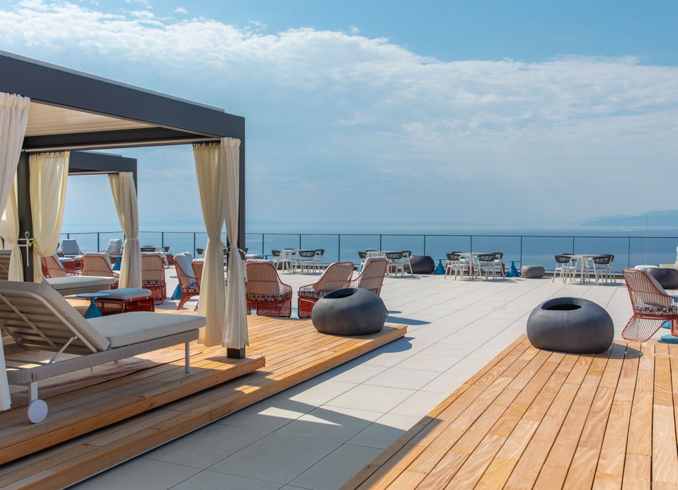 Aminess Vollo Residences sun terrace with loungers and sea view.