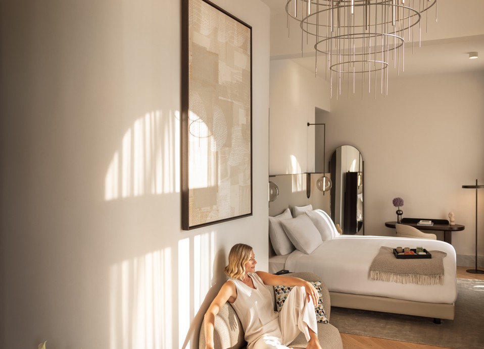 Guest relaxing in an elegant room at Younique Korcula Heritage Hotel.