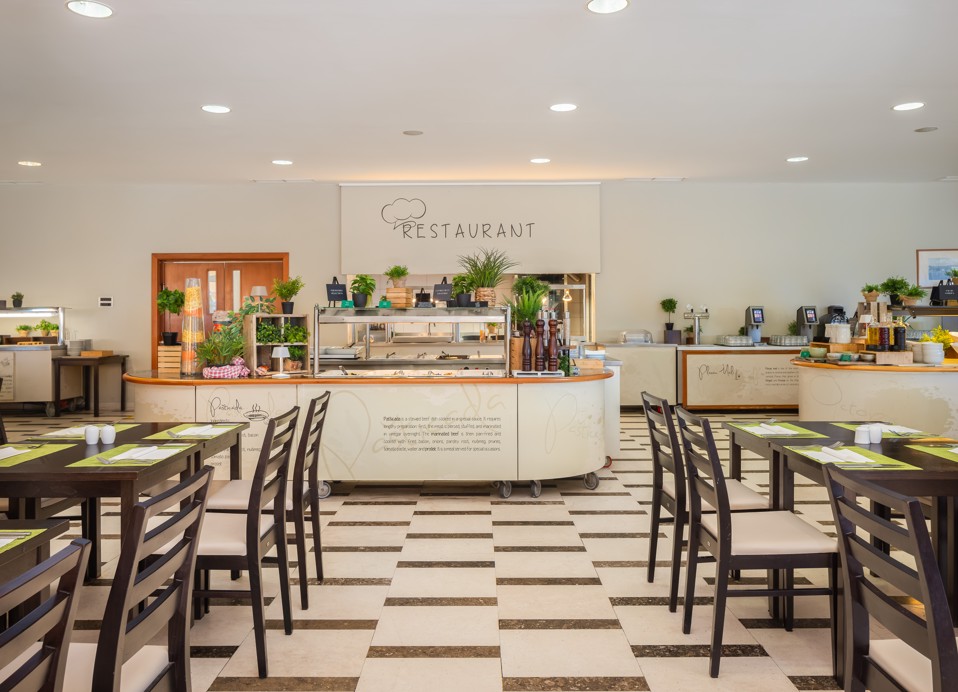 Buffet restaurant at Aminess Vival Grand Azur Hotel with neatly arranged tables.