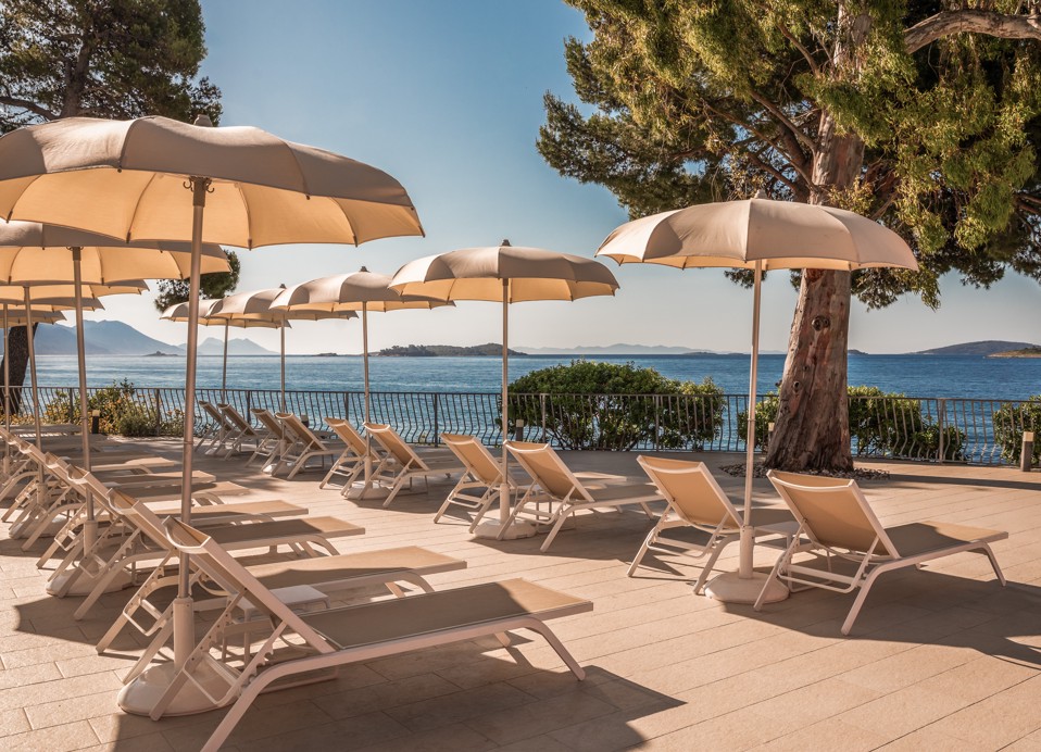 Hotel exterior pool by night near Aminess Maradiso Bellevue Village.