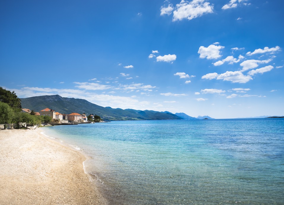 Beautiful sandy beach with turquoise waters at Aminess Maradiso Bellevue Village.ic