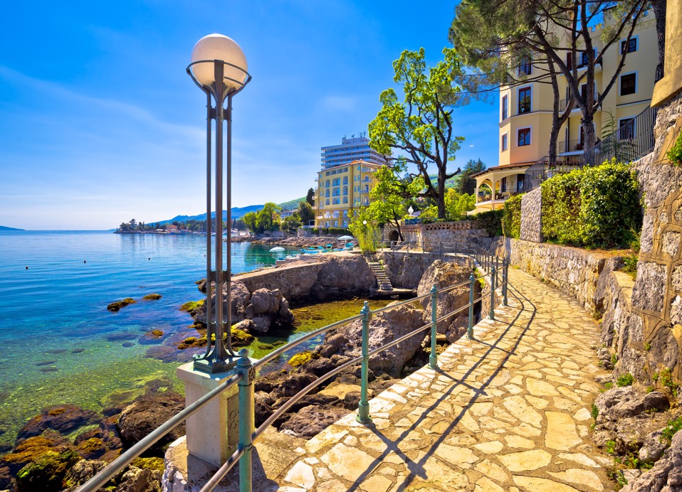 Seaside promenade in Opatija overlooking historic villas and the crystal-clear Kvarner Sea, reflecting the rich history and elegance of the destination