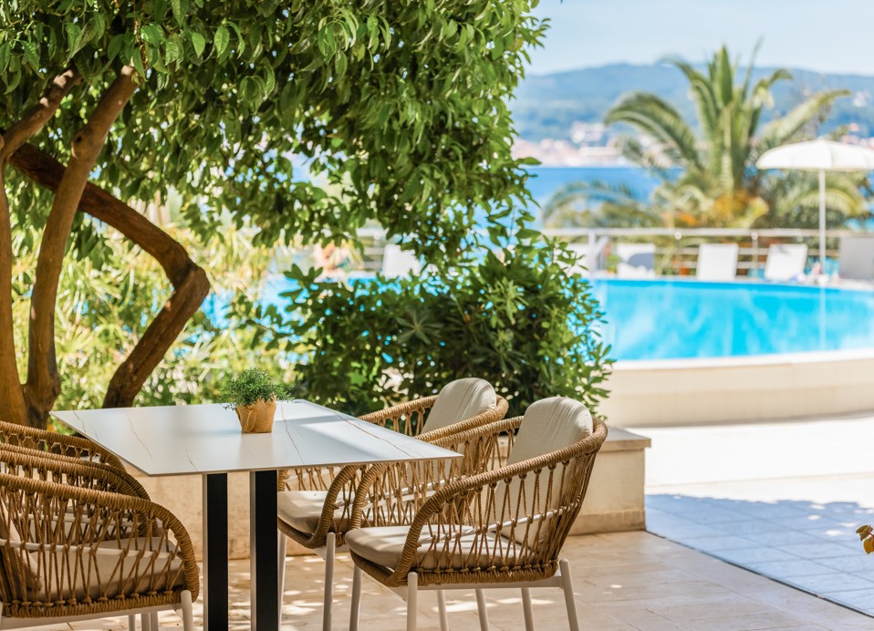 Garden bar table at Orsan Hotel in Orebić with pool and sea view