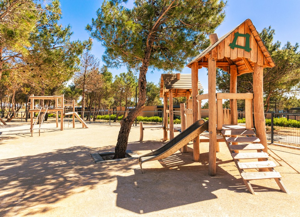 Slide for children in outdoor playground at Aminess Style Camping Avalona resort.