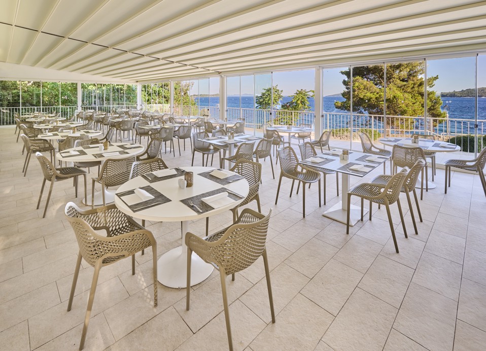 Restaurant Rondela terrace overlooking the sea view with modern interior and exterior seating terrace at Aminess Maradiso Casa Bellevue.