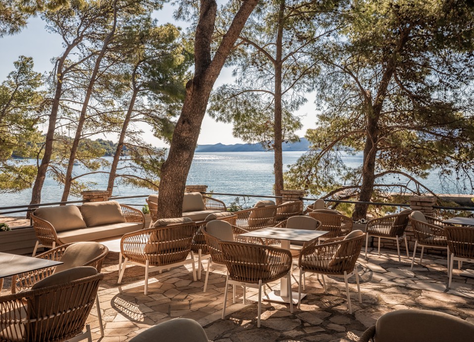 Terrace bar at Aminess Younique Senses Resort on Hvar Island set in pine shade with sea view