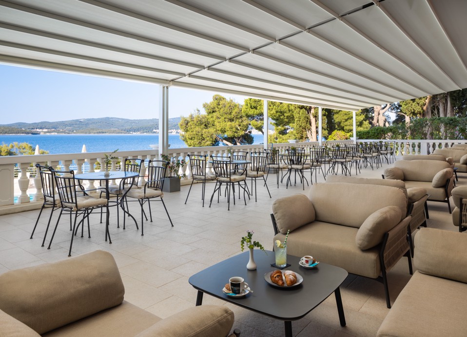 Bar Noir terrace at Younique Bellevue Hotel by Aminess with lounge seating and sea view.