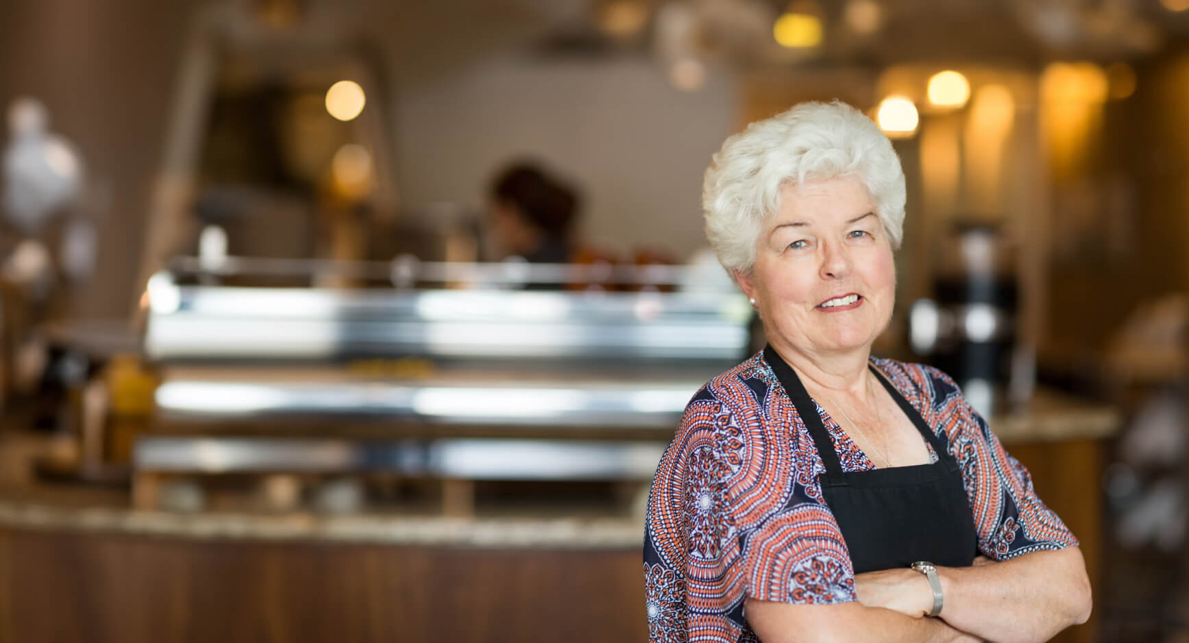 Portrait of a senior woman with an apron