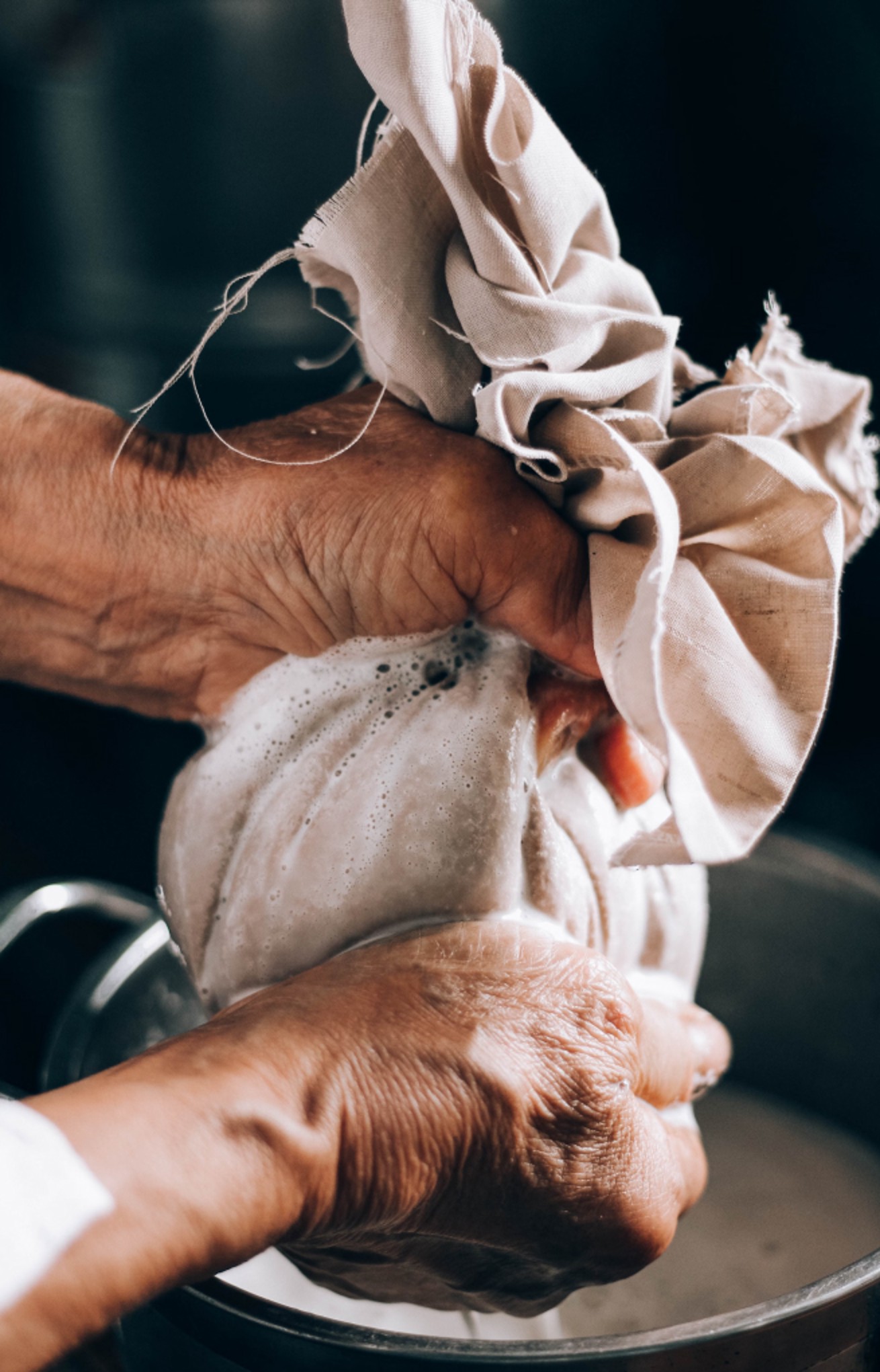 Hands squeezing pastry